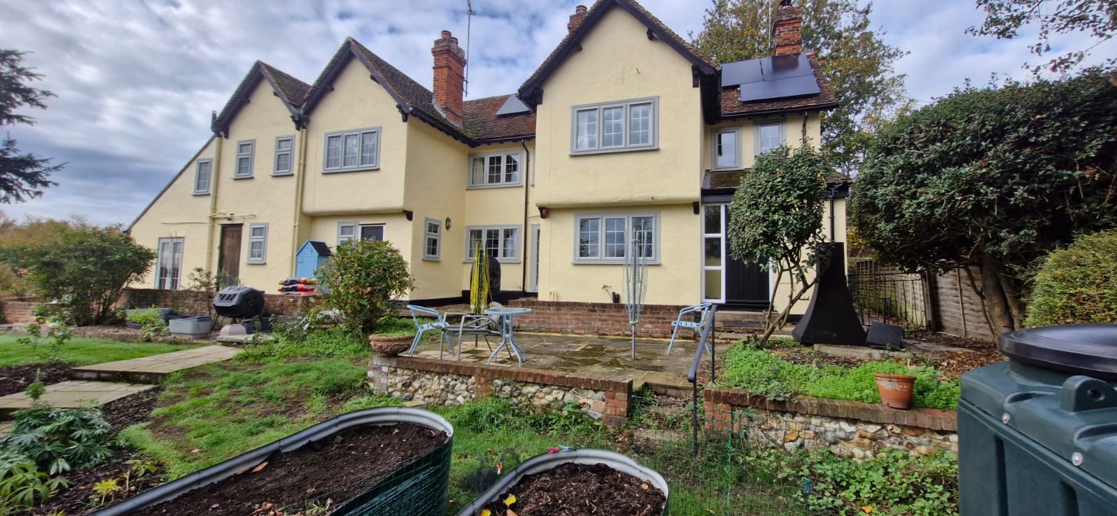 The cream period house at Blackmore End after its exterior repaint